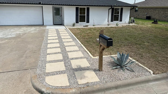 walkway with pavers leading to front door of house